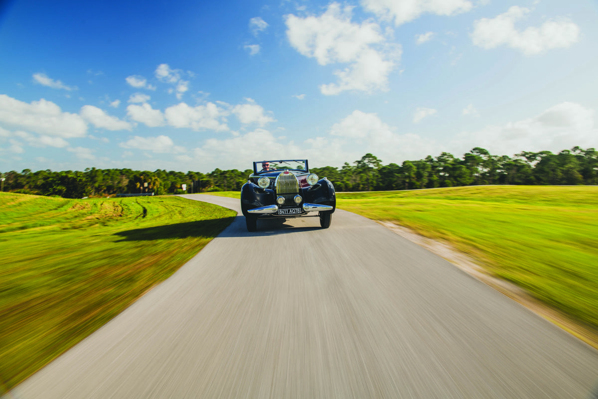 Driving shot of 1938 Bugatti Type 57 Cabriolet by D'Ieteren offered at RM Sotheby's Amelia Island live auction 2020